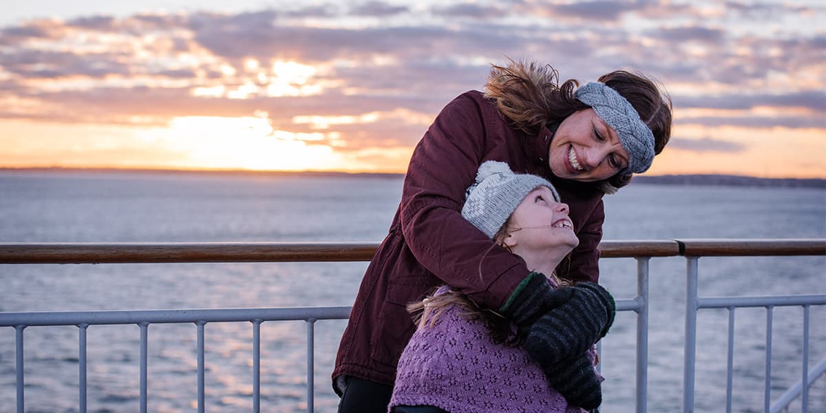 Family time. Mother and daughter on deck - winter