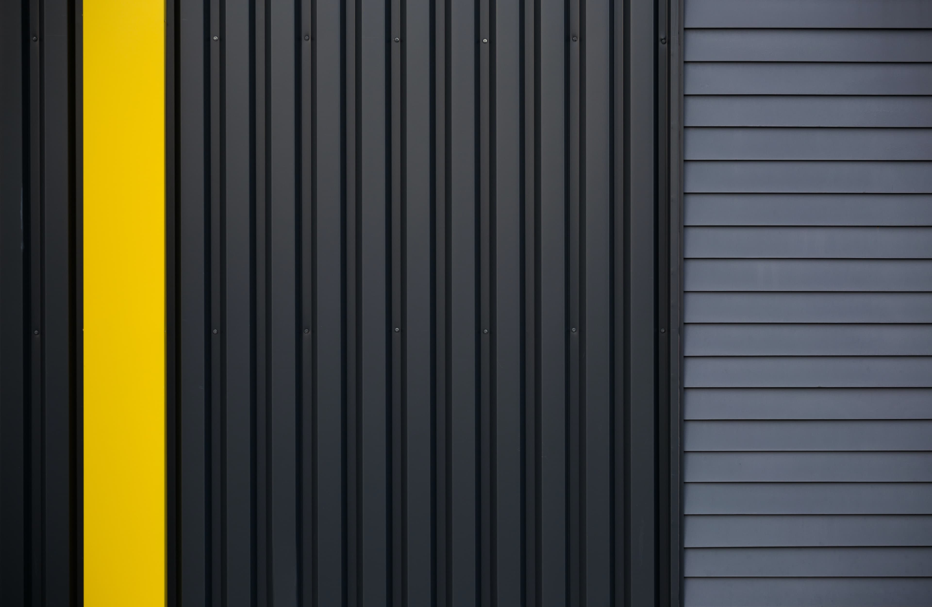 Close up image of the side of a warehouse paneling.
