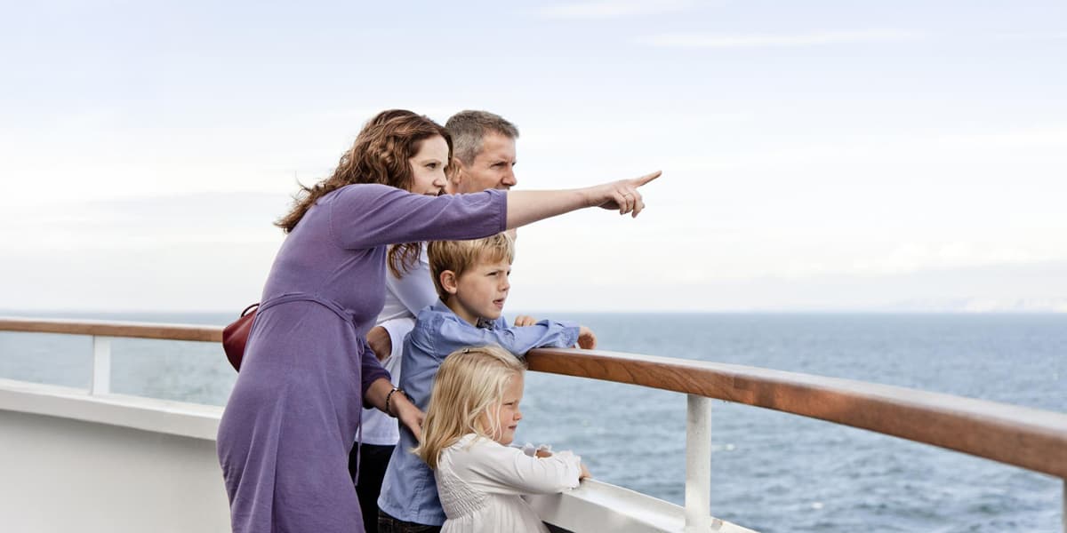 Family on the deck of the DFDS while the mother points to something in the distance